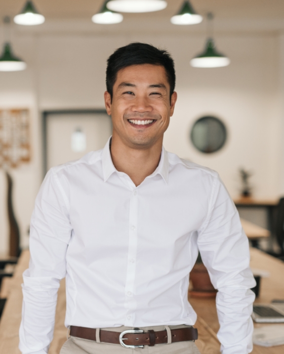 Man in white button down shirt smiling