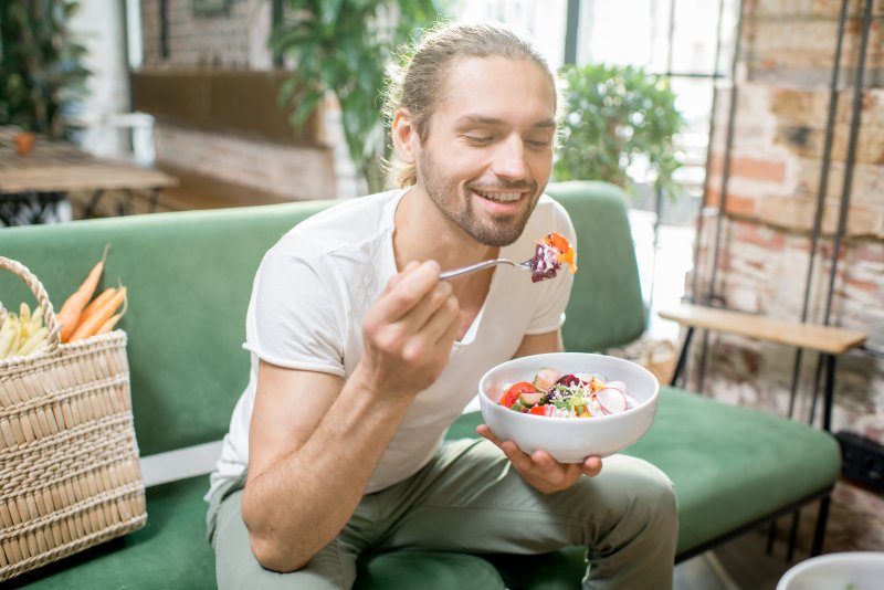 Patient eating with veneers